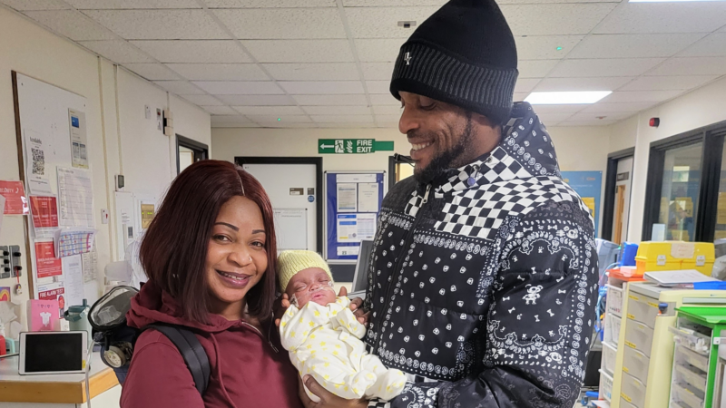 Parents OJ and Samuel holding baby Desire on the neonatal unit